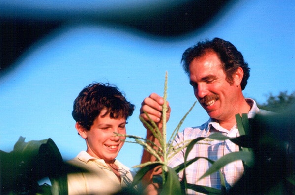 Aaron Whealy and Kent Whealy with corn